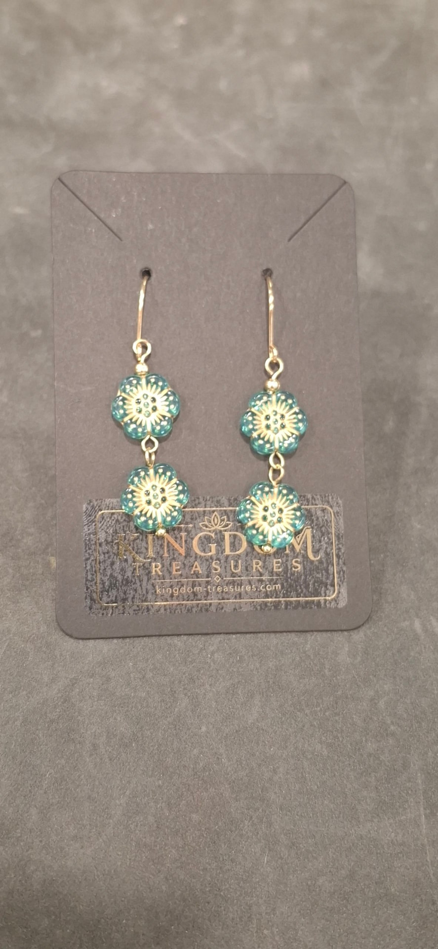 Teal and gold flower drop earrings on Kingdom Treasures card